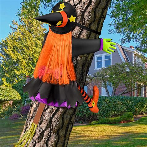 Make a Statement this Halloween with a Witch Statuette Hitting a Tree Decoration